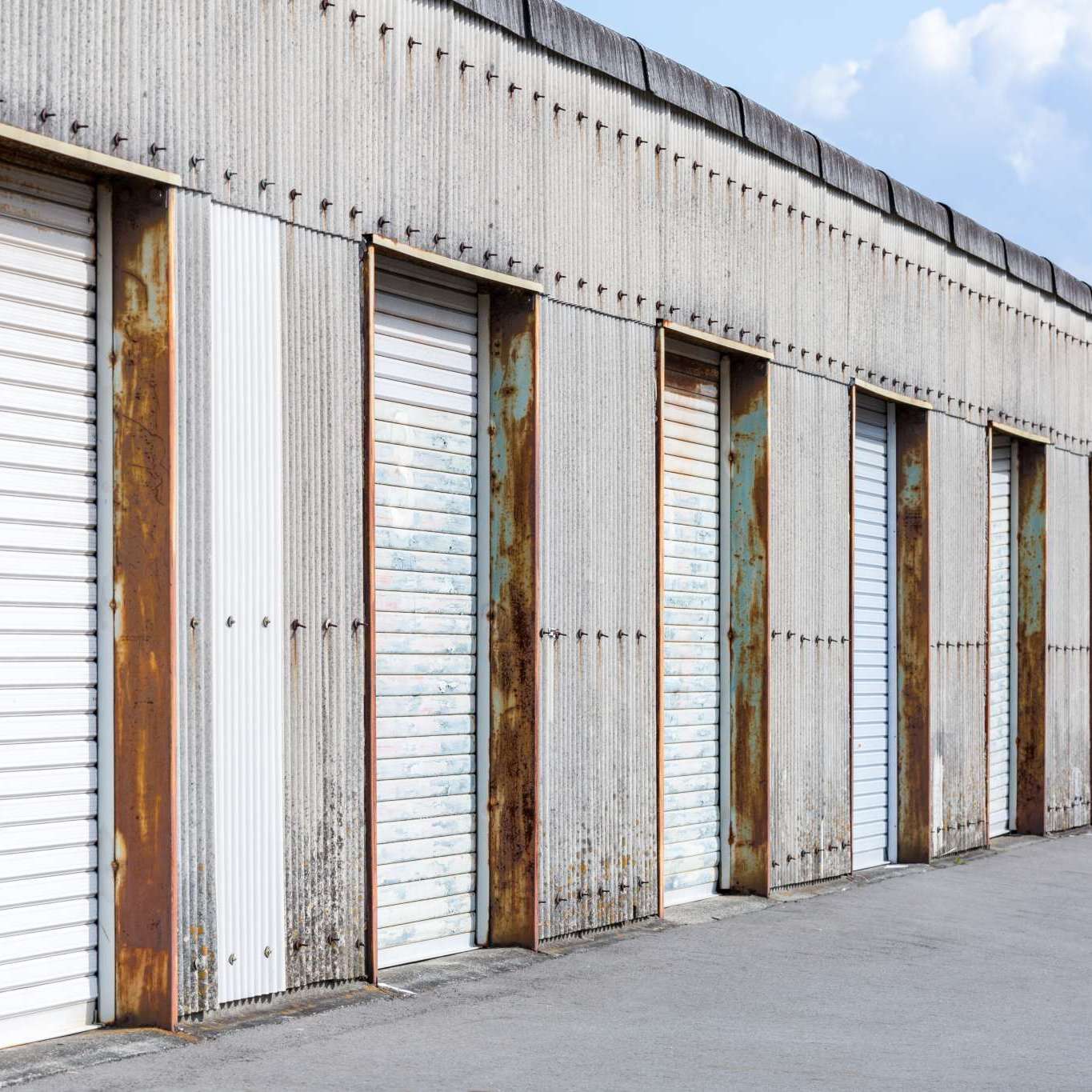 Self Storage Unit Shutter door or roller door of factory building use for industrial background.